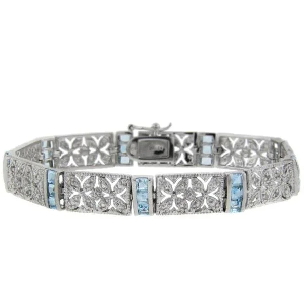 Raw pearl bracelet-Dolce Giavonna Sterling Silver Blue Topaz and Diamond Accent Filigree Flower Bracelet